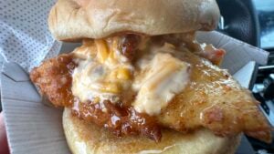 Close-up view of Chick-fil-A Honey Pepper Pimento Chicken Sandwich with pimento cheese
